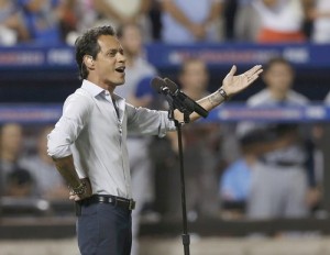 Marc Anthony sings God Bless America during the seventh inning stretch at Major League Baseball's All-Star Game in New York City